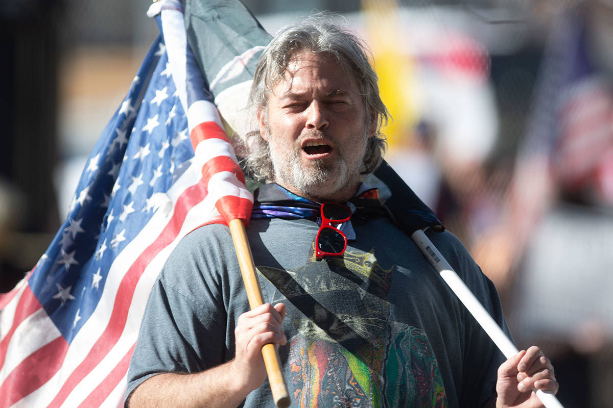 A protester outside on the first day of the 81st session of the Nevada Legislature in Carson Ci ...