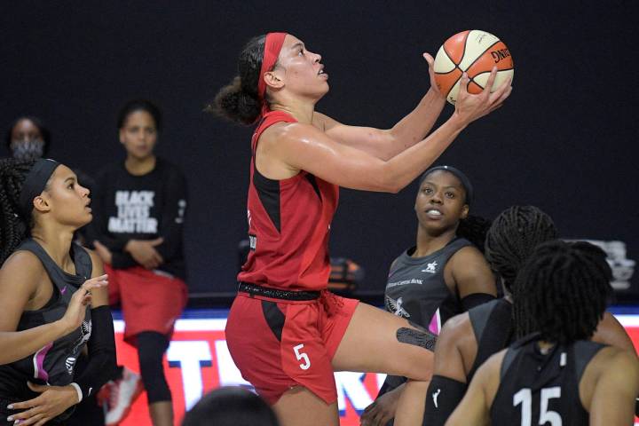 Las Vegas Aces forward Dearica Hamby goes up for a shot during the first half of the team's WNB ...