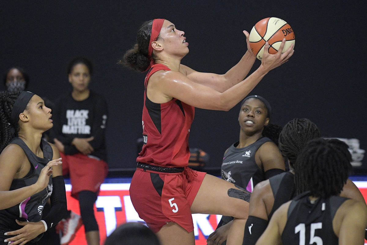 Las Vegas Aces forward Dearica Hamby goes up for a shot during the first half of the team's WNB ...