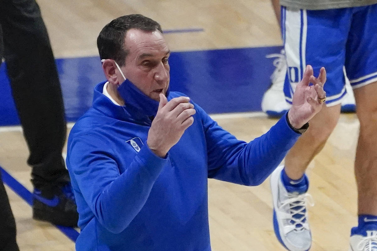 Duke coach Mike Krzyzewski calls to players during the first half of the team's NCAA college ba ...