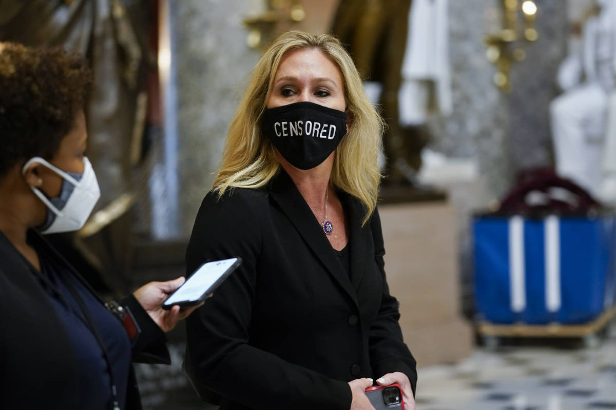 Rep. Marjorie Taylor Greene, R-Ga., walks on Capitol Hill in Washington, Wednesday, Jan. 13, 20 ...