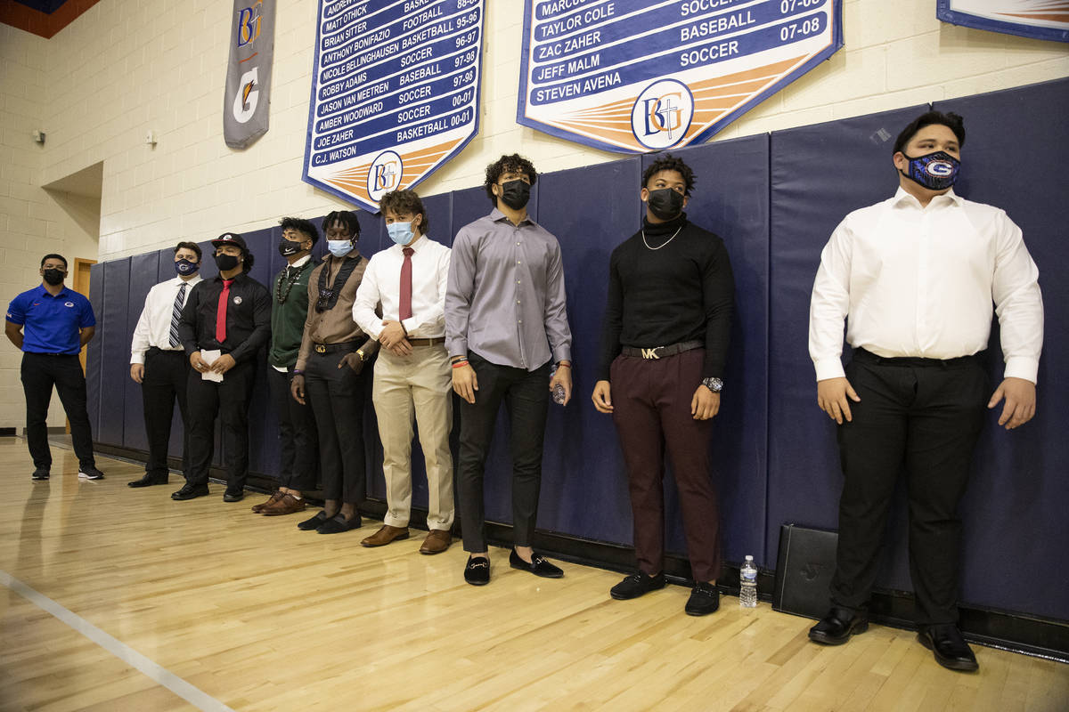 Students participate during a Signing day ceremony at Bishop Gorman High School in Las Vegas, o ...