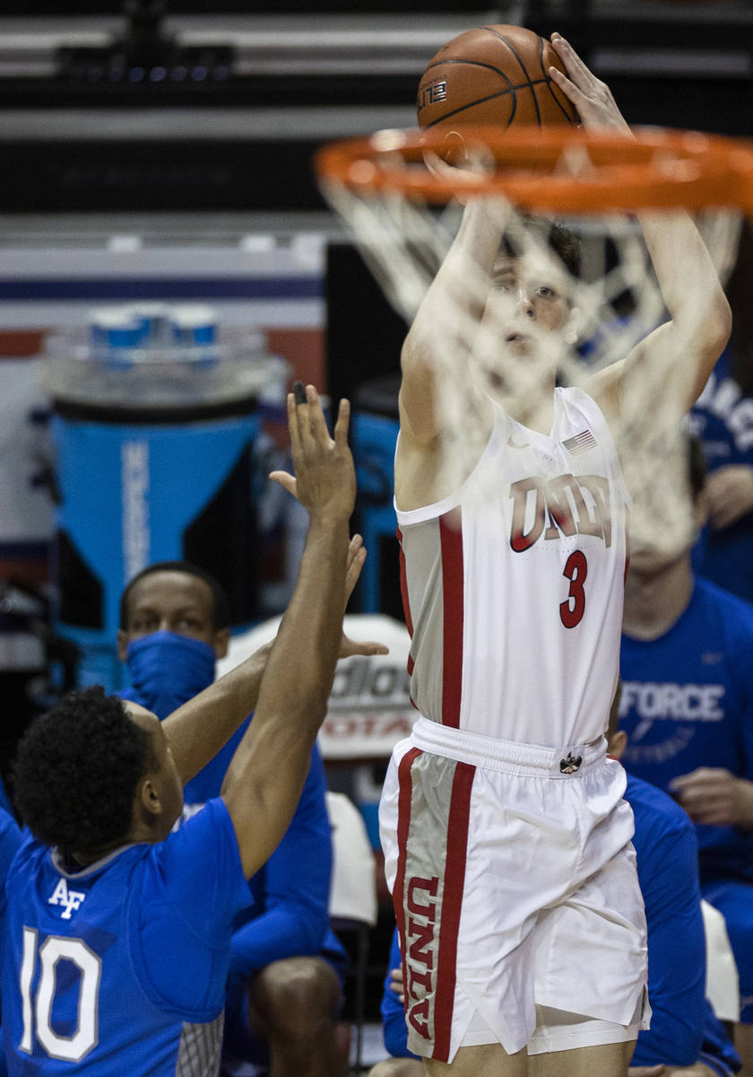 UNLV Rebels guard Caleb Grill (3) shoots a corner three over Air Force Falcons guard A.J. Walke ...