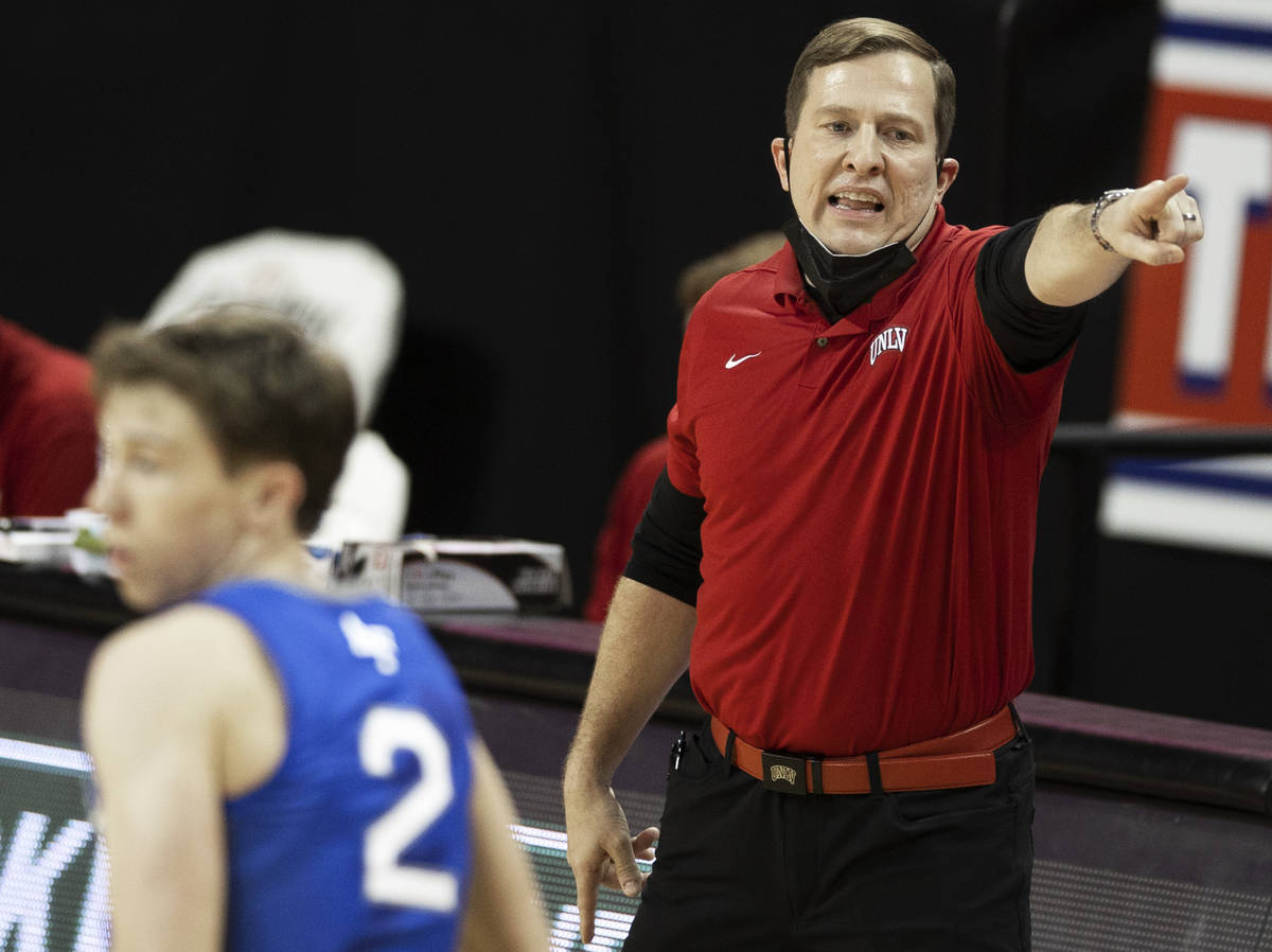 UNLV Rebels head coach T.J. Otzelberger calls a play in the first half during an NCAA mens bask ...
