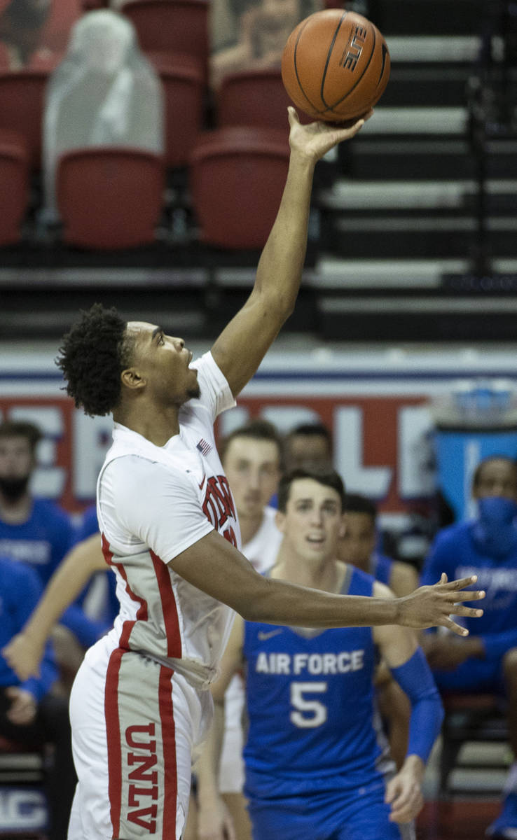 UNLV Rebels guard Bryce Hamilton (13) shoots over Air Force Falcons guard Chris Joyce (5) in th ...