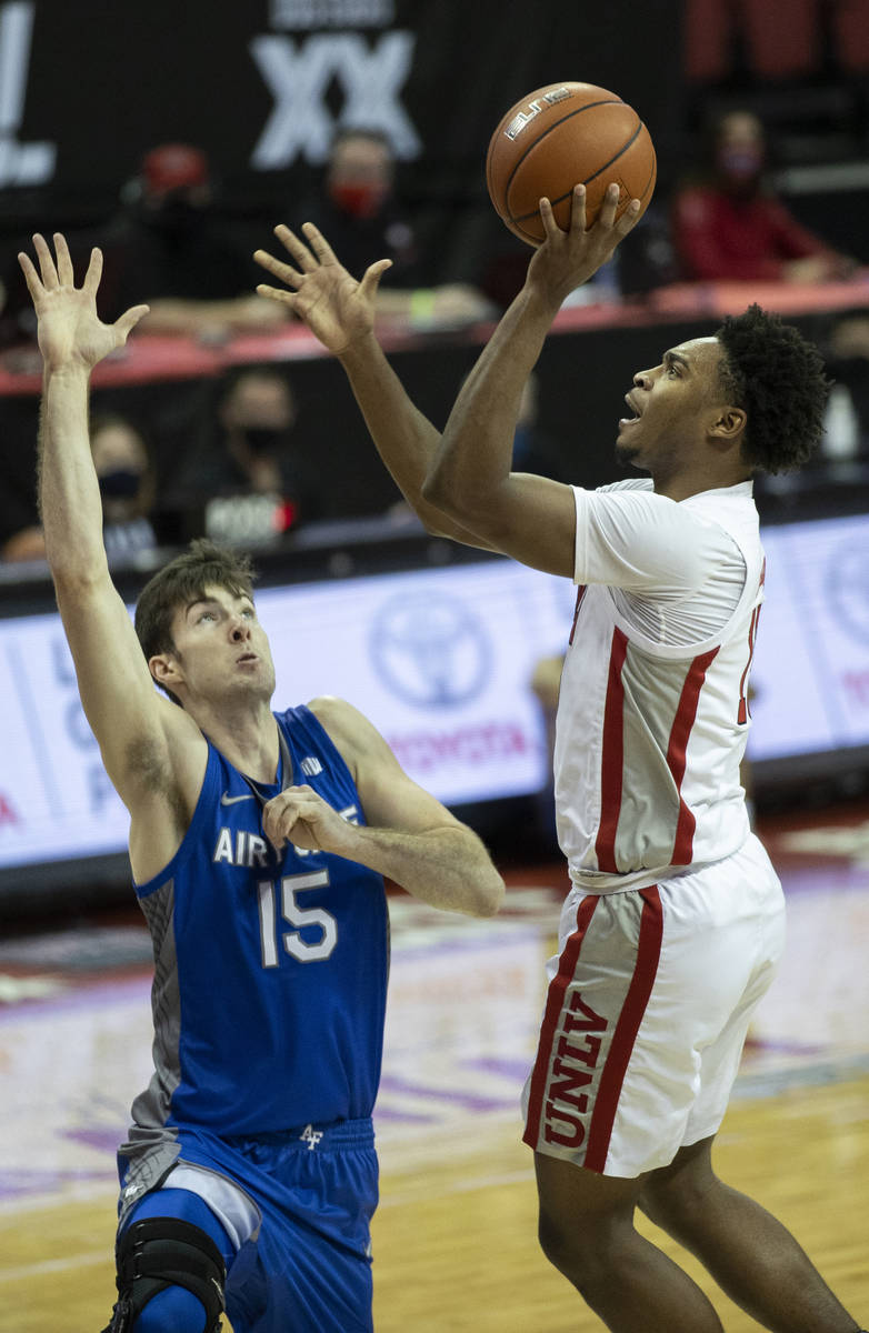 UNLV Rebels guard Bryce Hamilton (13) shoots over Air Force Falcons forward Abe Kinrade (15) in ...
