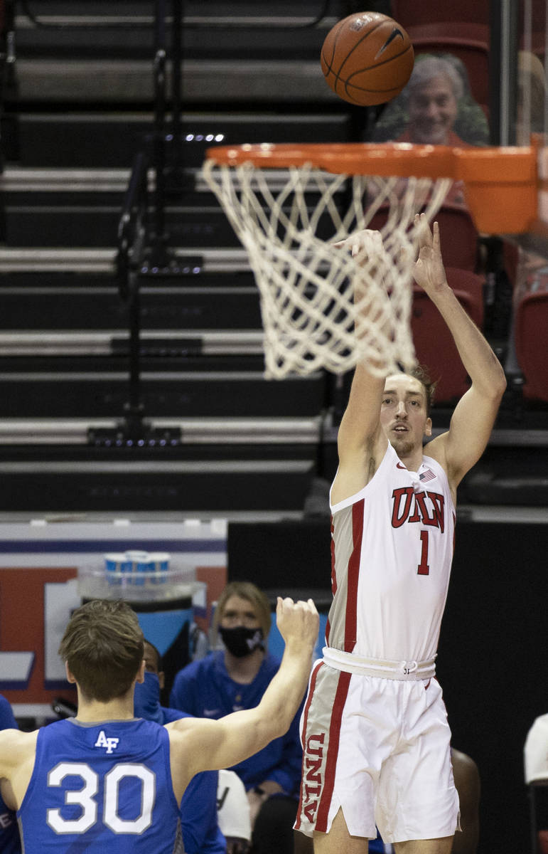 UNLV Rebels forward Moses Wood (1) shoots a corner three over Air Force Falcons guard Camden Va ...