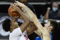 UNLV Rebels guard Bryce Hamilton (13) takes a contested shot over Air Force Falcons guard Mason ...