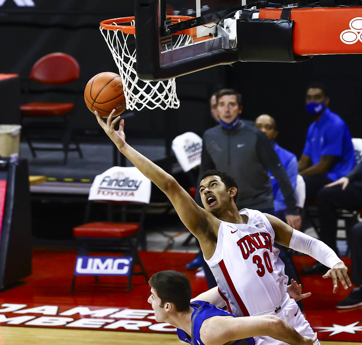 UNLV Rebels forward Devin Tillis (30) reaches for a rebound during the first half of a basketba ...