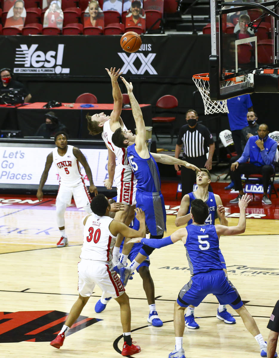 UNLV Rebels forward Moses Wood shoots over Air Force Falcons forward Abe Kinrade (15) during th ...