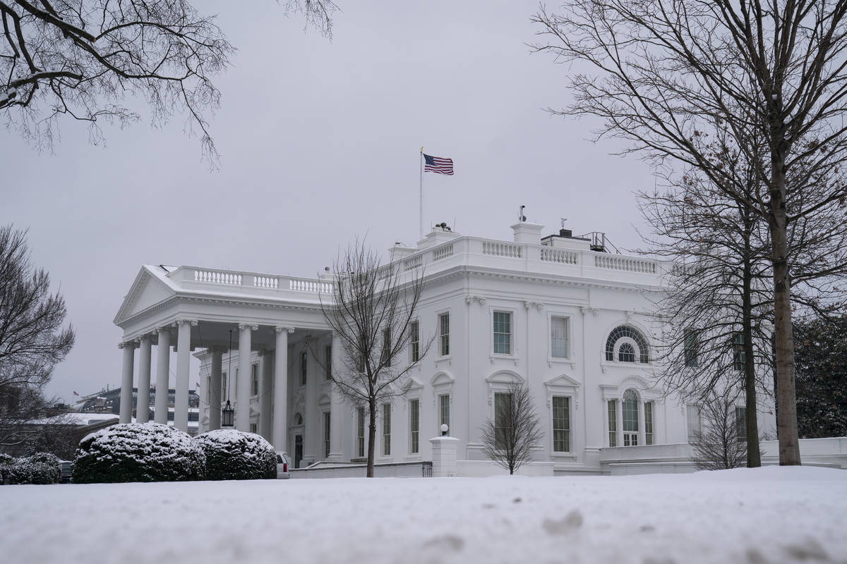 Snow covers the ground at the White House, Monday, Feb. 1, 2021, in Washington. (AP Photo/Evan ...