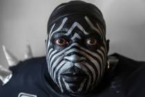 Raiders super fan Wayne Mabry, known as "Violator," in his hotel room at 4 a.m. in Du ...