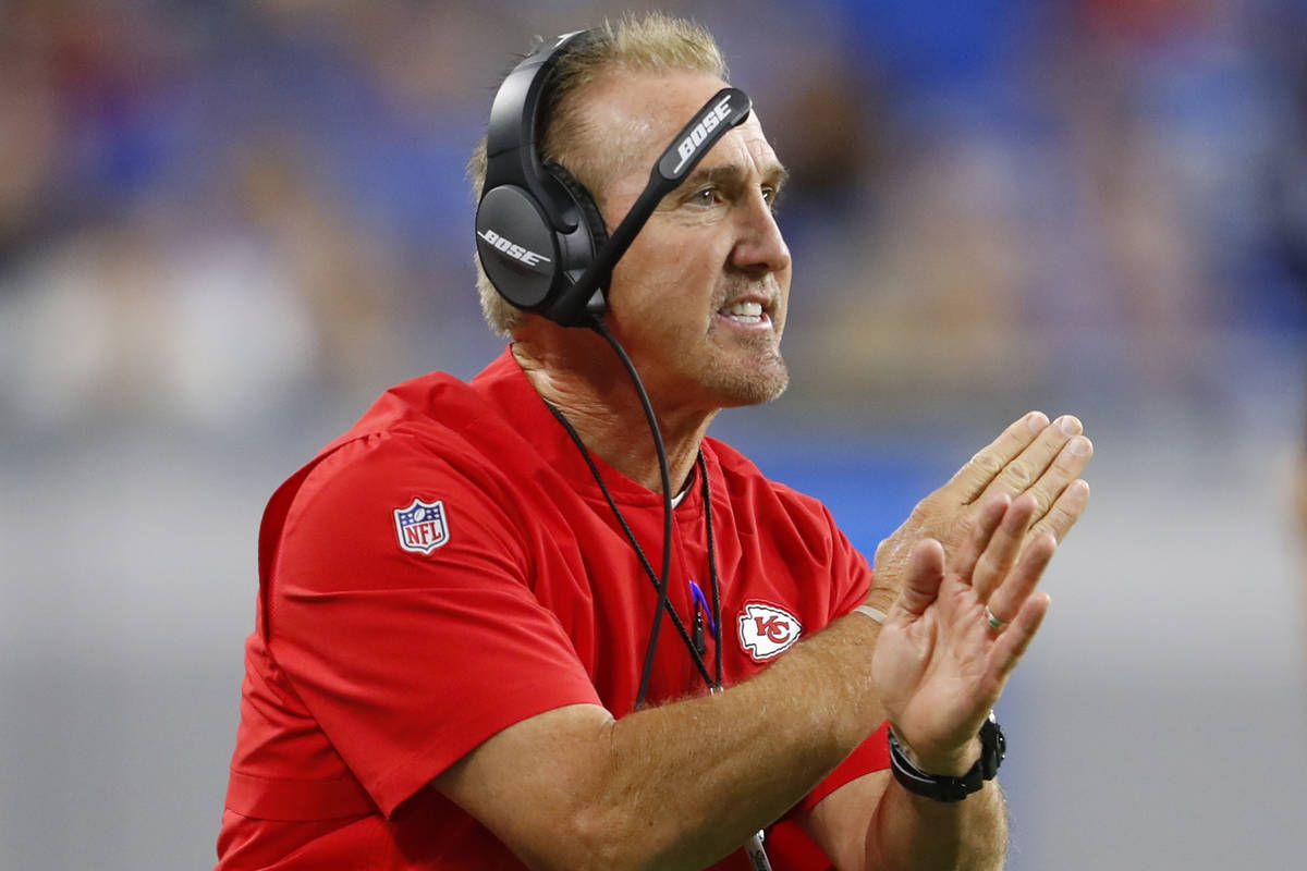 Kansas City Chiefs defensive coordinator Steve Spagnuolo signals during an NFL football game ag ...