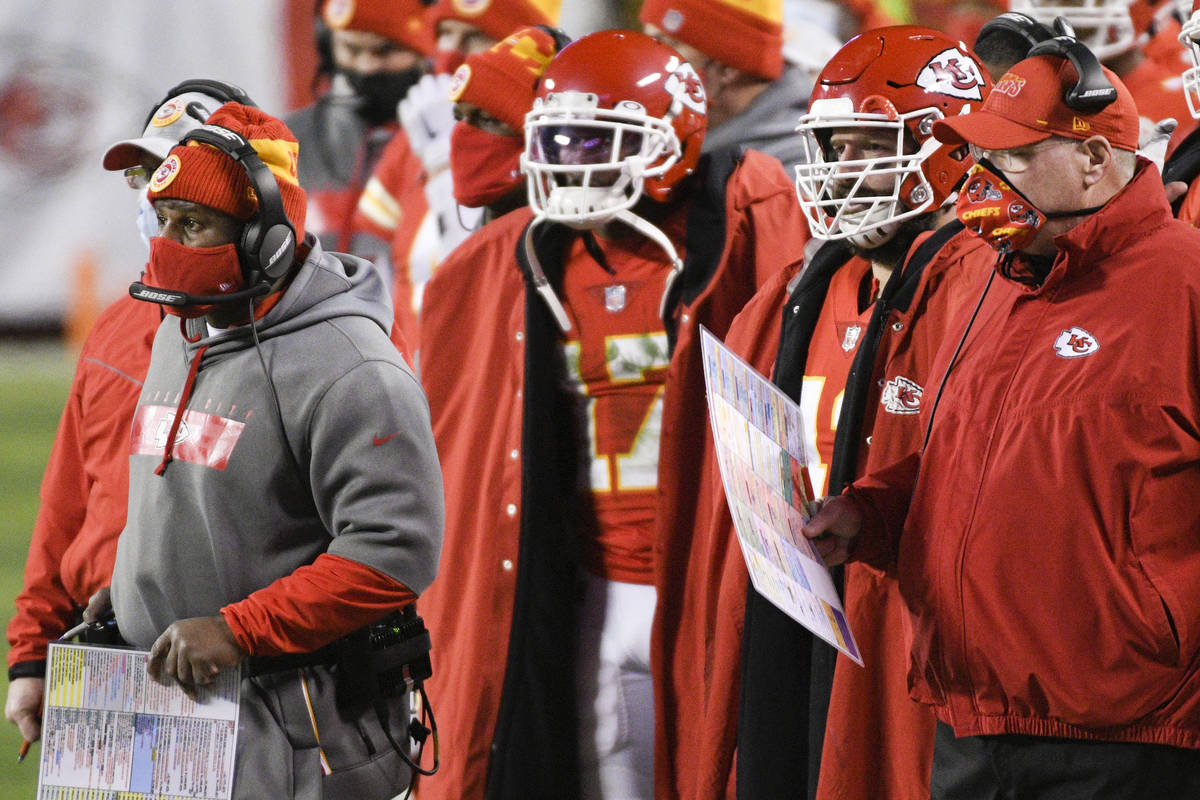 Kansas City Chiefs head coach Andy Reid (right) and offensive coordinator Eric Bieniemy (far le ...