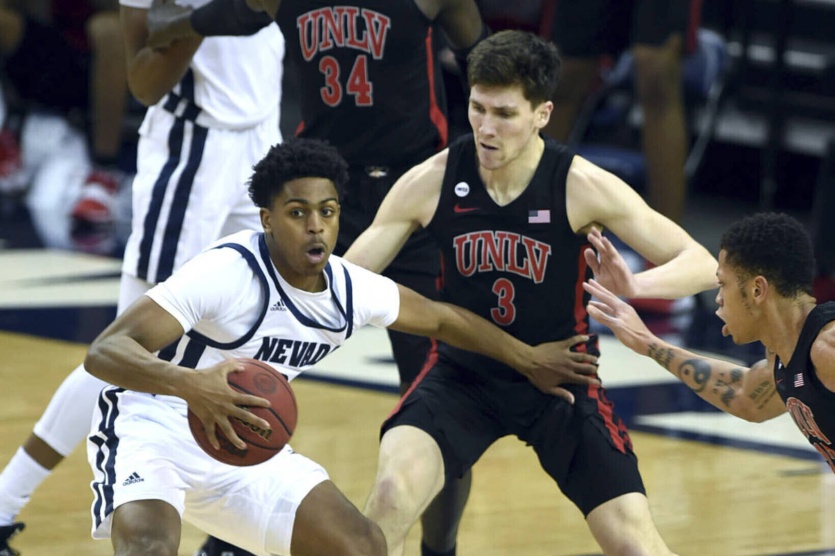 Nevada's Grant Sherfield dribbles the ball against UNLV during the first half of an NCAA colleg ...