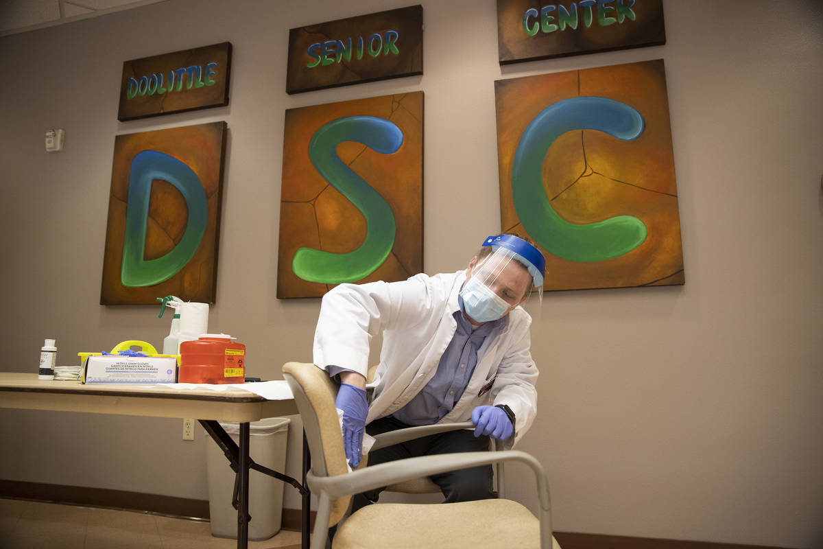 Justin McConnell, student pharmacist at Roseman University of Health Sciences, gets ready to ad ...
