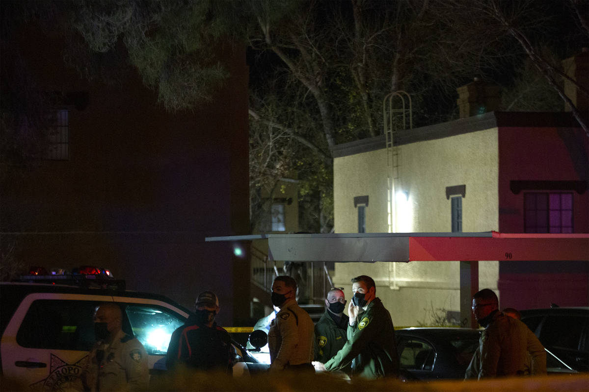 Metropolitan police investigate a homicide near the intersection of Lake Mead Boulevard and Los ...