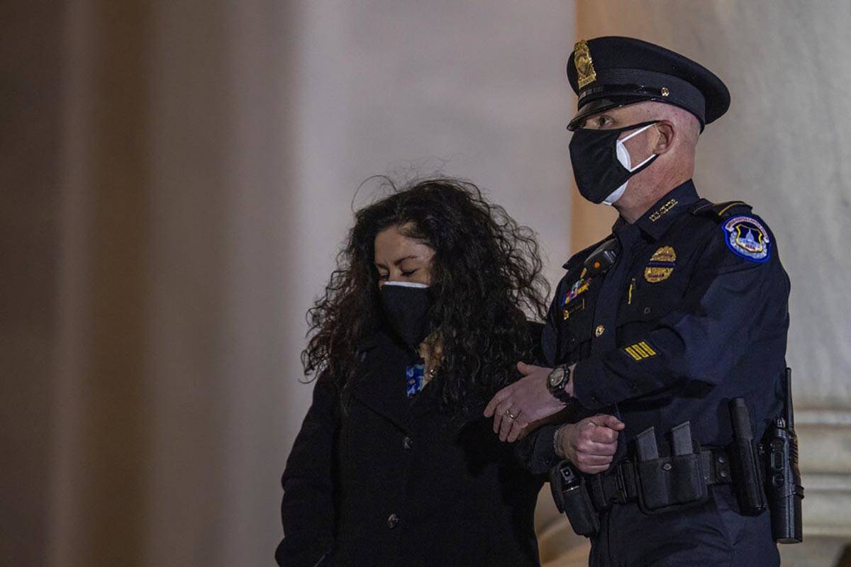 Family watches as an honor guard carries an urn with the cremated remains of U.S. Capitol Polic ...