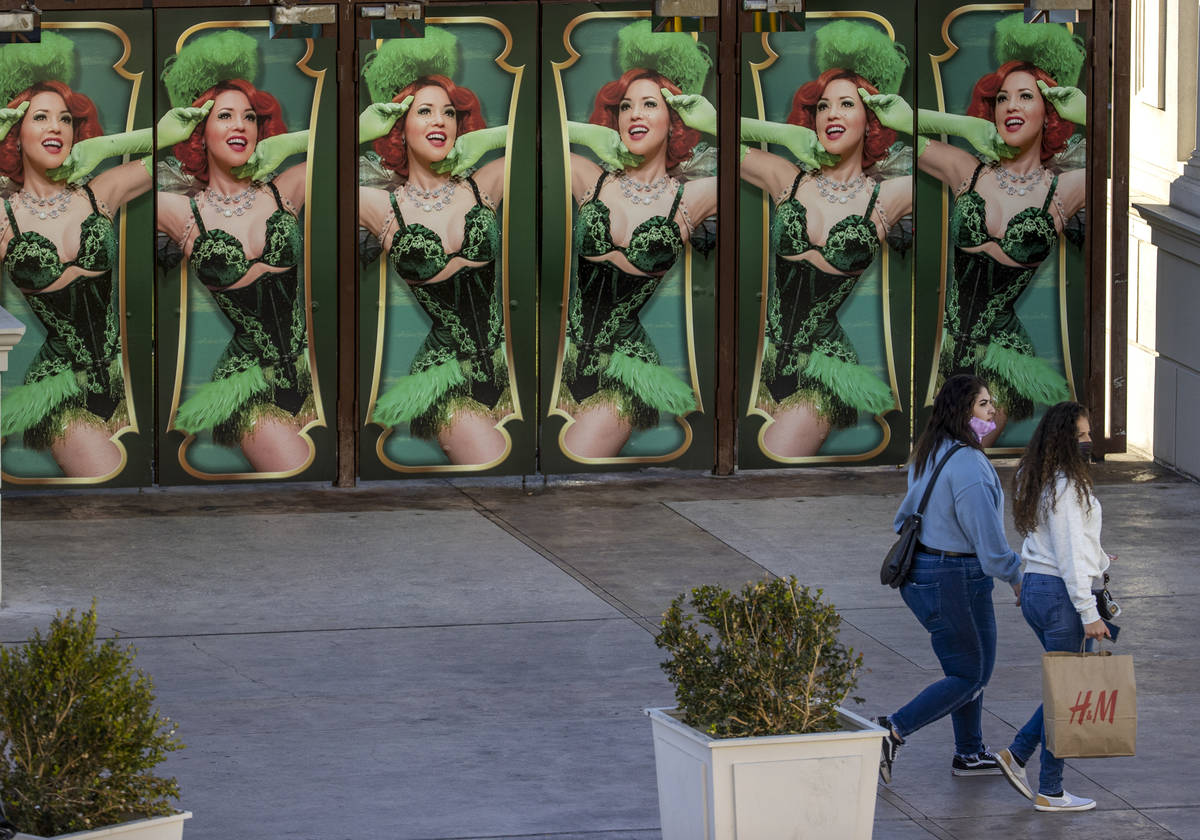 Several shoppers move past the Absinthe main doors nears Caesars Palace along the Las Vegas Str ...