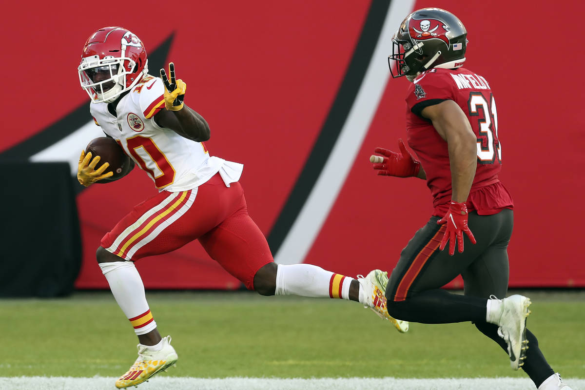 In this Nov. 29, 2020 file photo, Kansas City Chiefs wide receiver Tyreek Hill (10) reacts as h ...