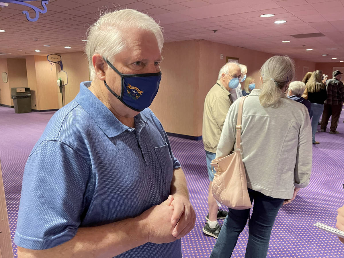Ken Pearson of Laughlin talks to a reporter while waiting in line for a COVID-19 vaccination at ...