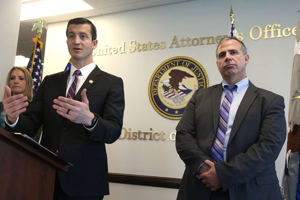 U.S. Attorney Nicholas Trutanich, flanked by IRS Special Agent in Charge Tara Sullivan and FBI ...