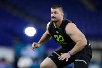 Boise State offensive lineman John Molchon runs a drill at the NFL football scouting combine in ...