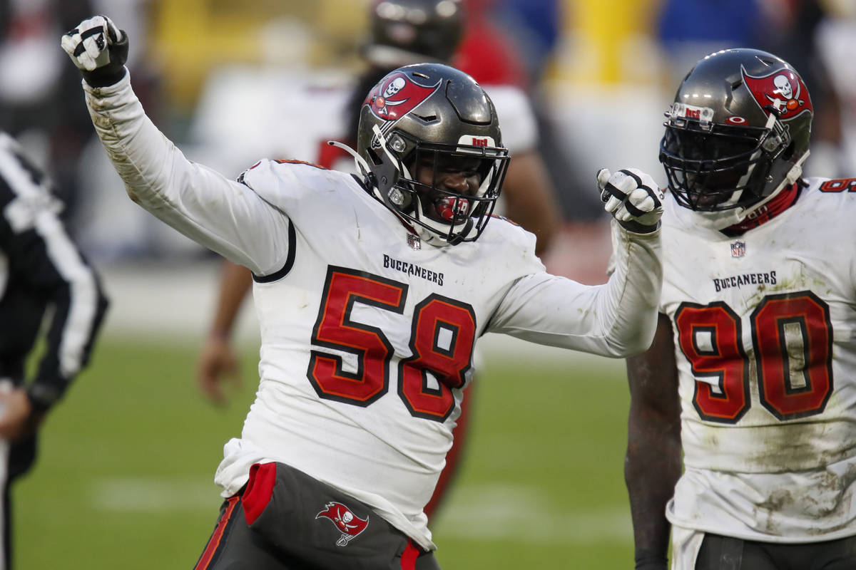 Tampa Bay Buccaneers' Shaquil Barrett (58) celebrates with teammate Jason Pierre-Paul after sac ...