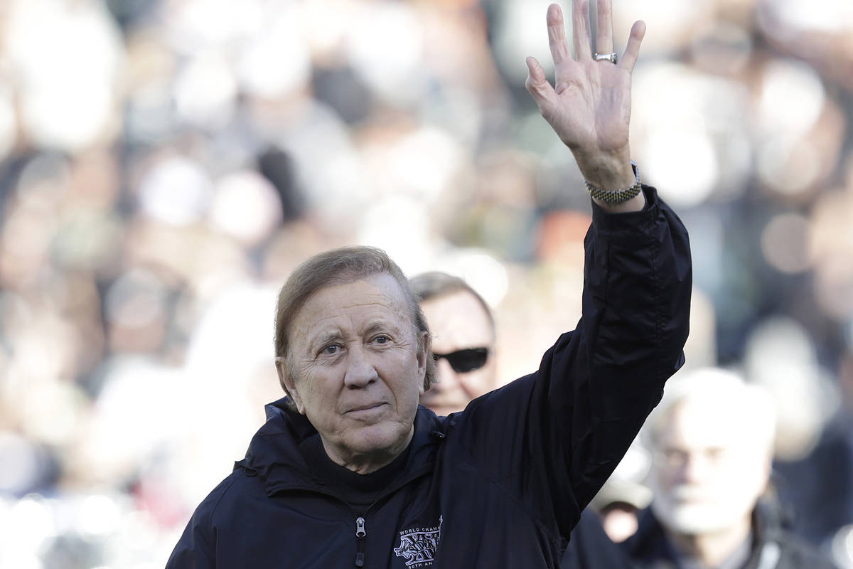 Former Oakland Raiders head coach Tom Flores waves during a ceremony honoring the 1983 Los Ange ...