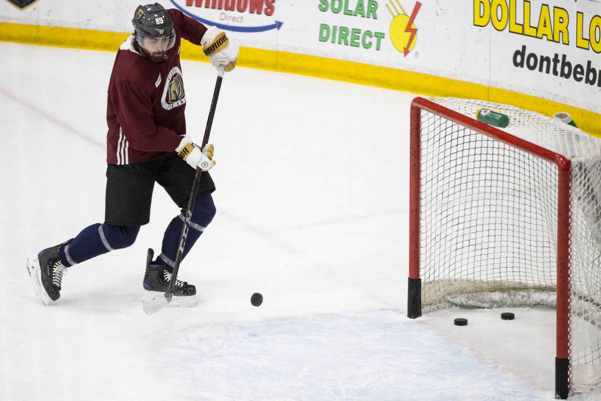 Vegas Golden Knights right wing Alex Tuch (89) takes a shot at the goal during a team practice ...