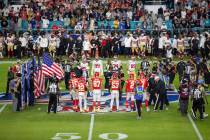 The San Francisco 49ers and Kansas City Chiefs' captains participate in the coin toss before Su ...