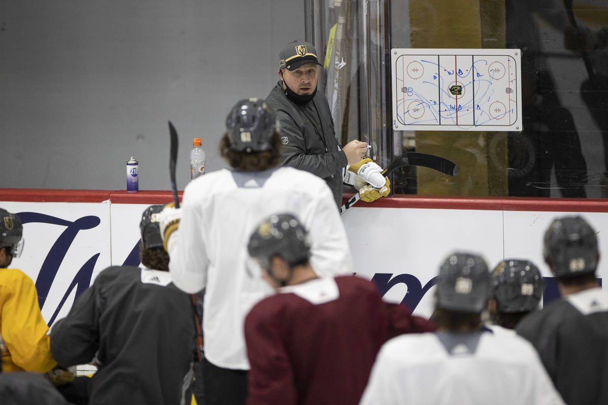 Vegas Golden Knights assistant coach Steve Spott speaks to his team during a practice at City N ...