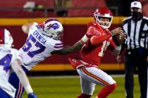 Kansas City Chiefs quarterback Patrick Mahomes is pressured by Buffalo Bills defensive end AJ E ...
