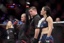 Paige Vanzant, left, celebrates after beating Rachael Ostovich in a women's flyweight mixed mar ...