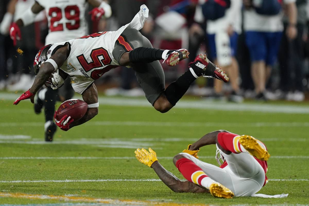 Kansas City Chiefs' Byron Pringle tackles Tampa Bay Buccaneers' Jaydon Mickens during the first ...