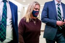 Rep. Marjorie Taylor Greene, R-Ga., walks back to her office after speaking on the floor of the ...