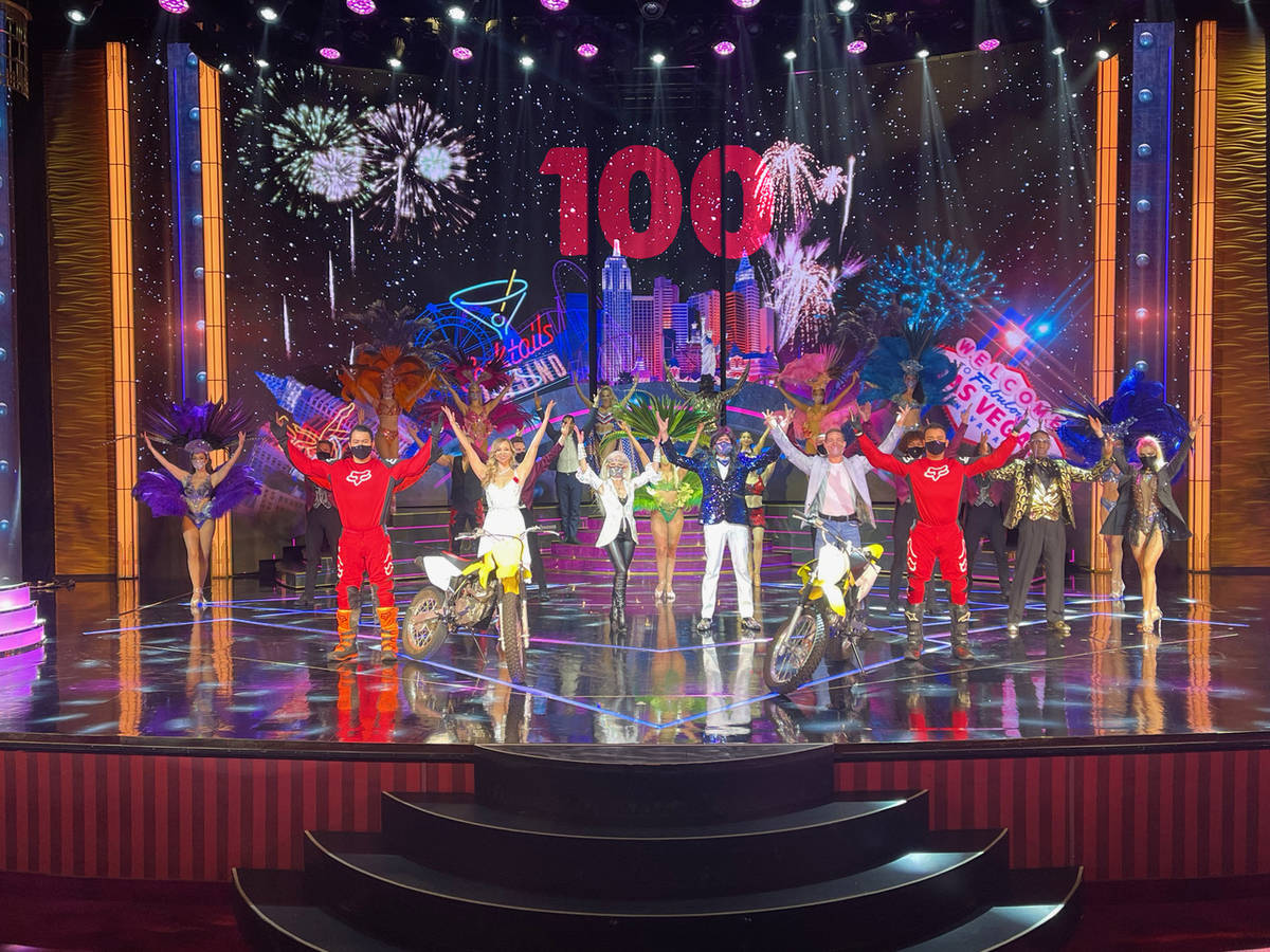 The cast of “Extravaganza” celebrates its 100th show at Bally’s on