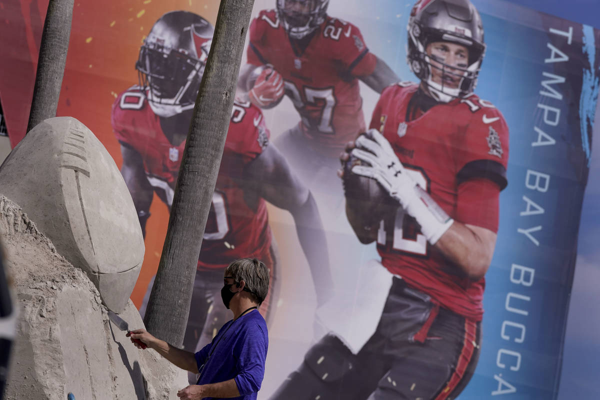 Dan Belcher sculpts the Lombardi Trophy out of sand outside Raymond James Stadium ahead of Supe ...