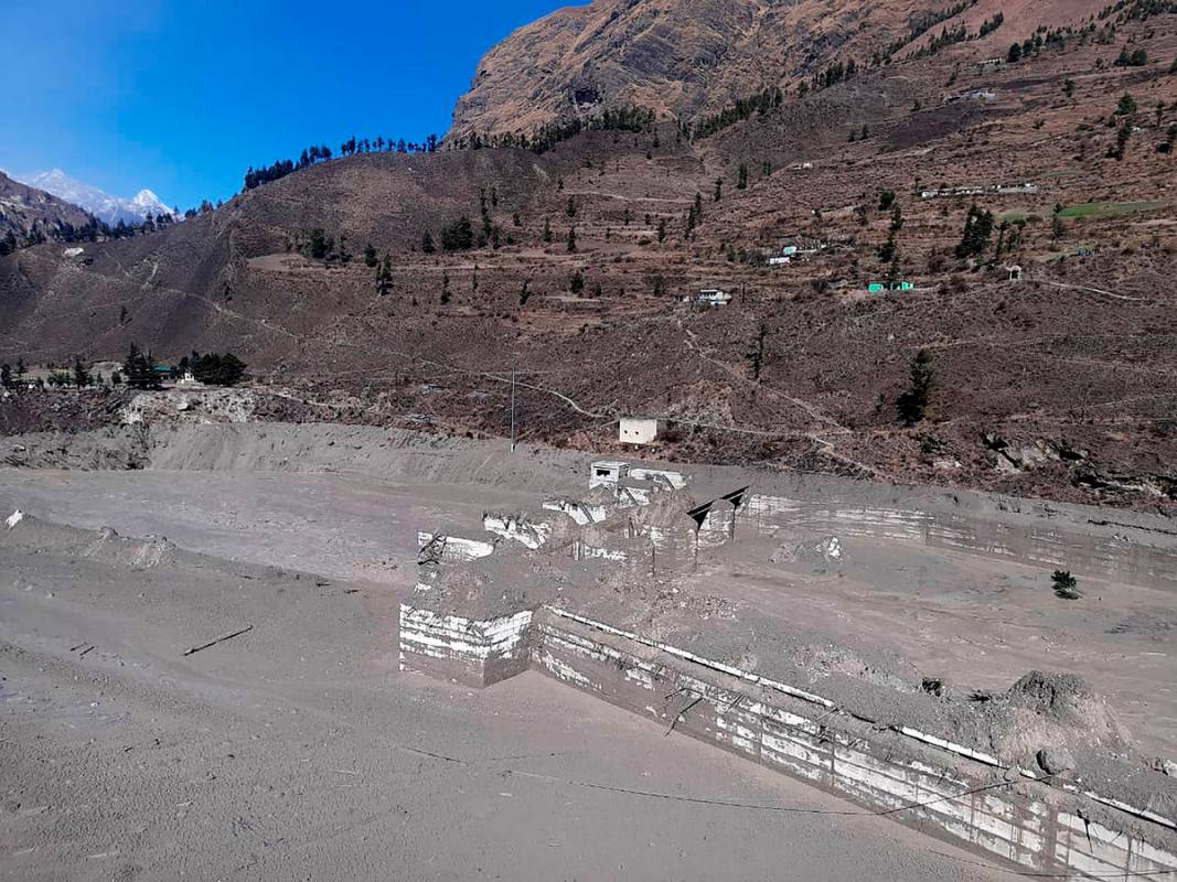 A view of the damaged Dhauliganga hydropower project at Reni village in Chamoli district after ...