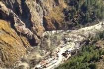 This frame grab from video provided by KK Productions shows a massive flood of water, mud and d ...