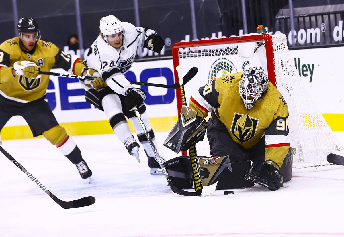 Golden Knights goaltender Robin Lehner (90) stops the puck against Los Angeles Kings center Lia ...