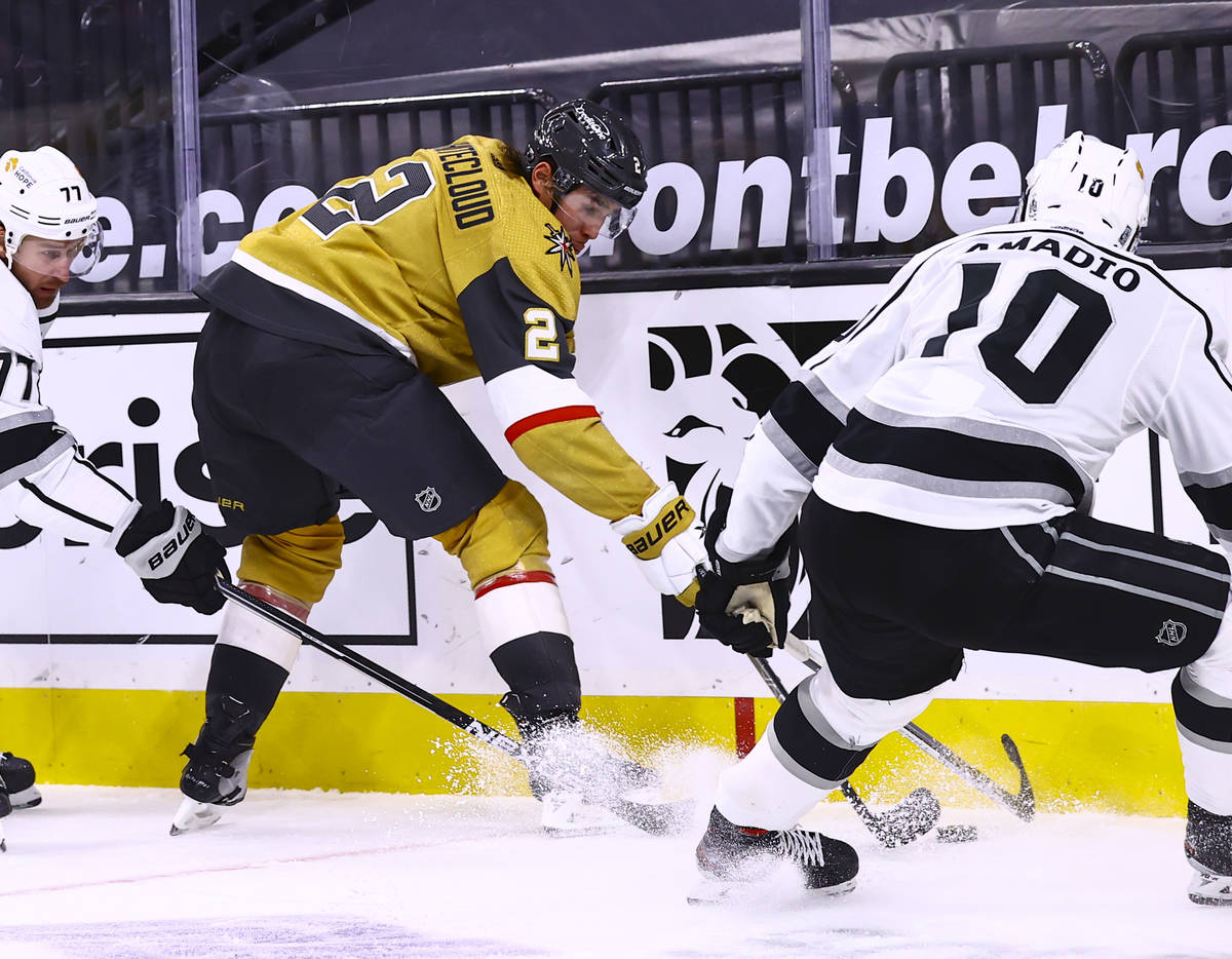 Golden Knights defenseman Zach Whitecloud (2) battles for the puck against Los Angeles Kings ce ...