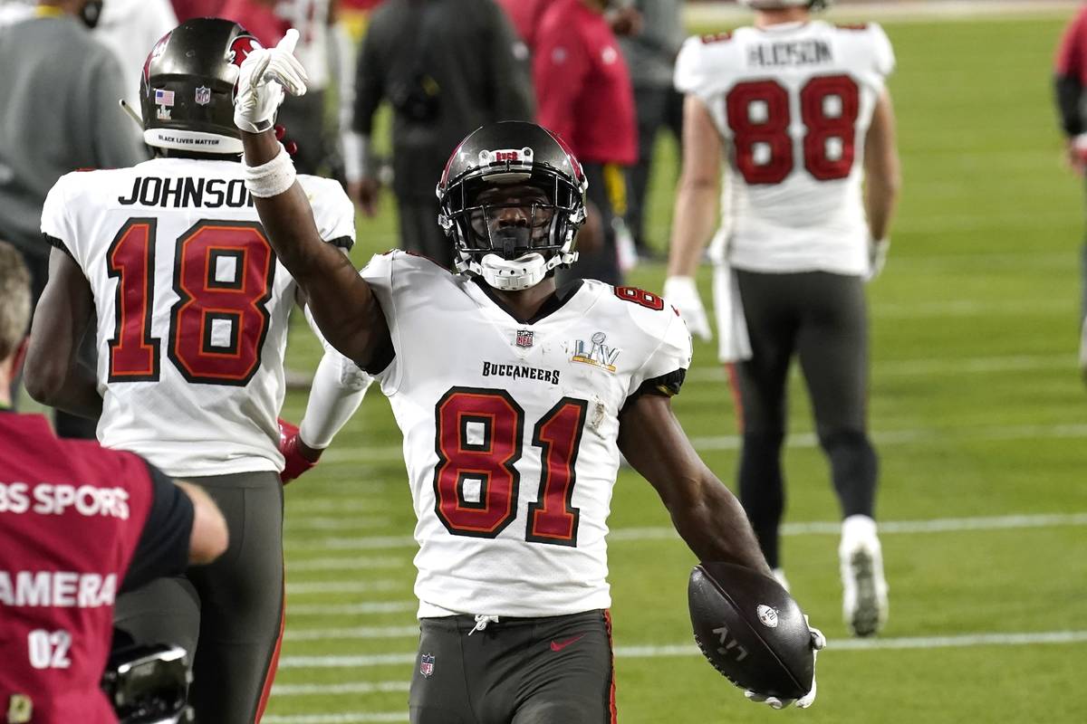 Tampa Bay Buccaneers wide receiver Antonio Brown celebrates after catching a 1-yard touchdown p ...