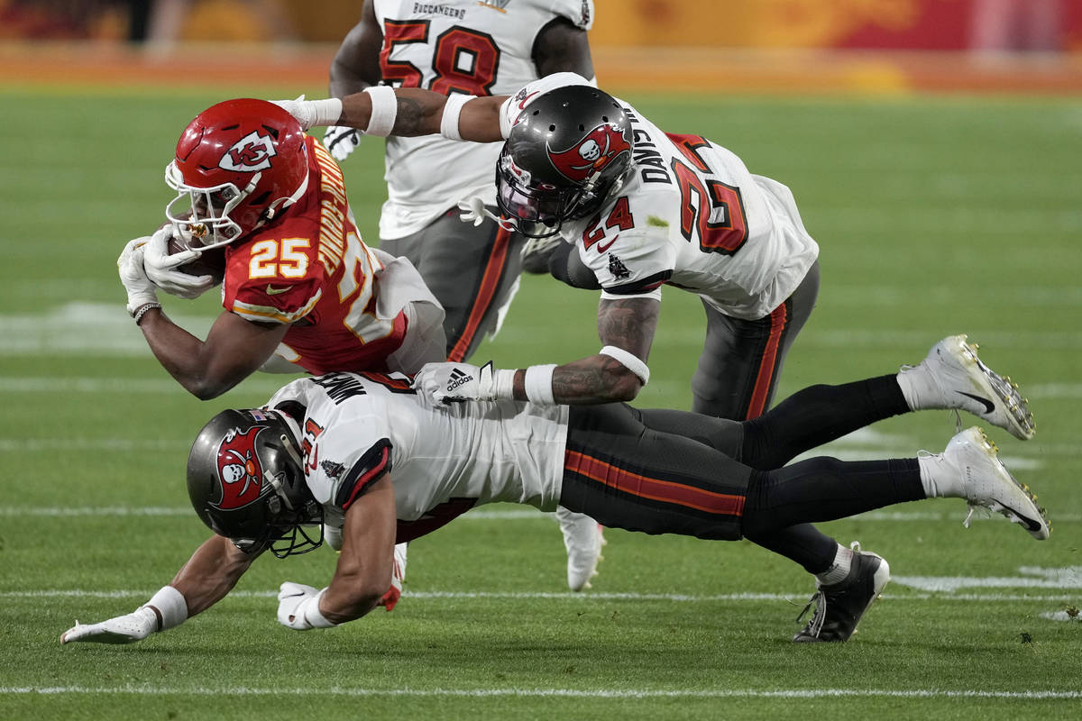 Kansas City Chiefs running back Clyde Edwards-Helaire is tackled by Tampa Bay Buccaneers strong ...