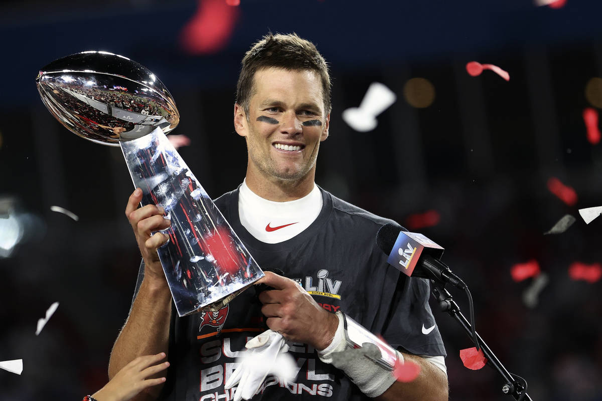 Tampa Bay Buccaneers quarterback Tom Brady (12) holds the Vince Lombardi trophy following the N ...