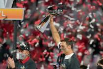 Tampa Bay Buccaneers quarterback Tom Brady celebrates with the Vince Lombardi Trophy after the ...