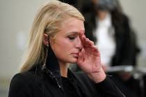 Paris Hilton wipes her eyes after speaking at a committee hearing at the Utah State Capitol, Mo ...