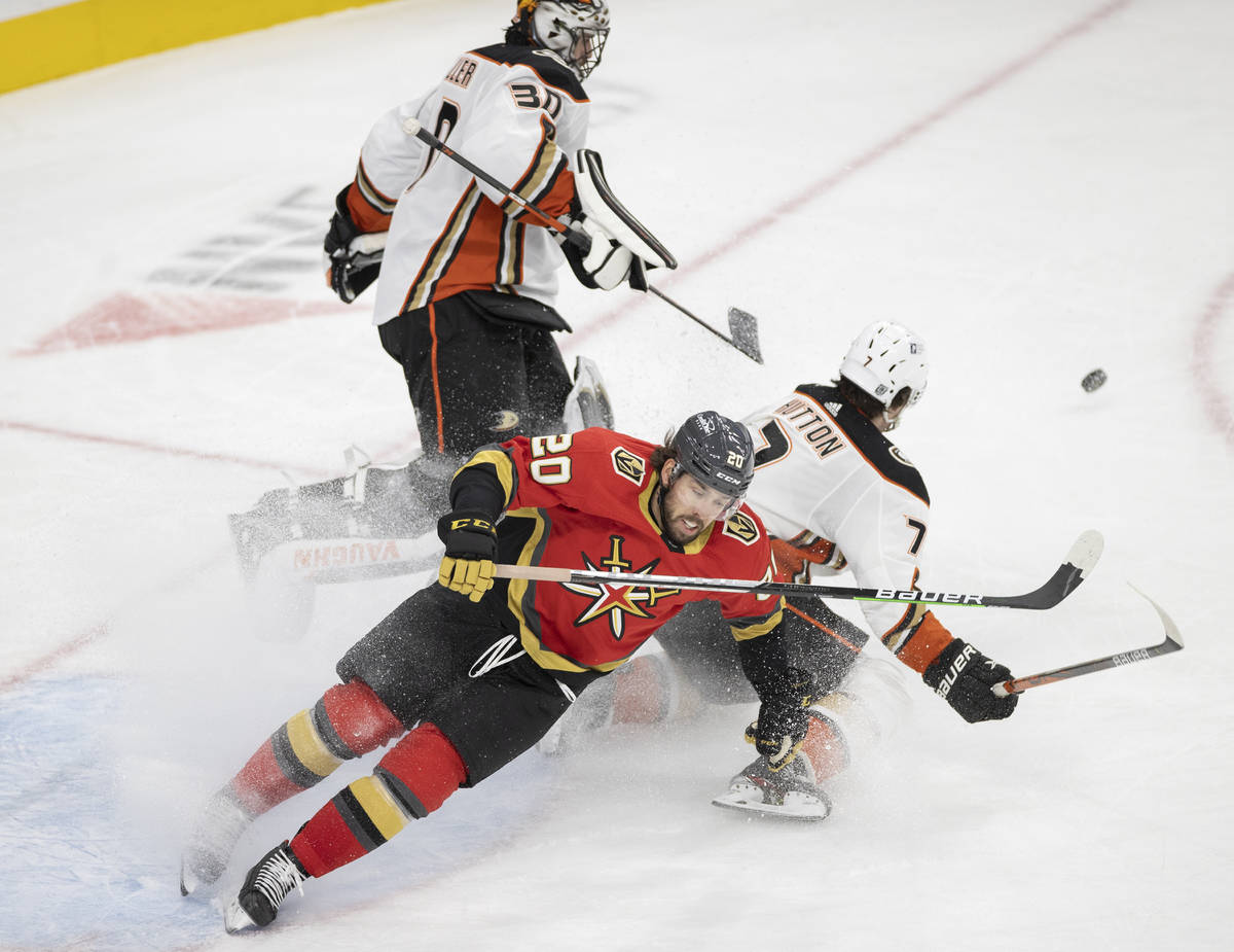 Vegas Golden Knights center Chandler Stephenson (20) collides with Anaheim Ducks defenseman Ben ...