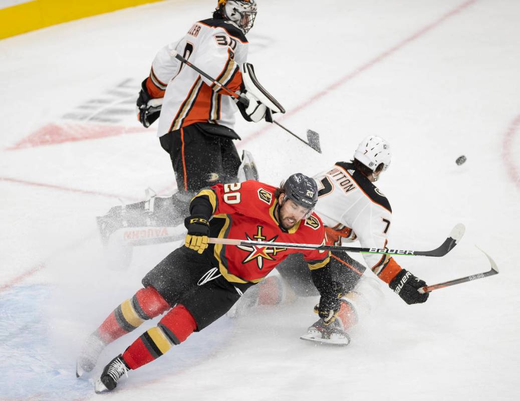 Vegas Golden Knights center Chandler Stephenson (20) collides with Anaheim Ducks defenseman Ben ...