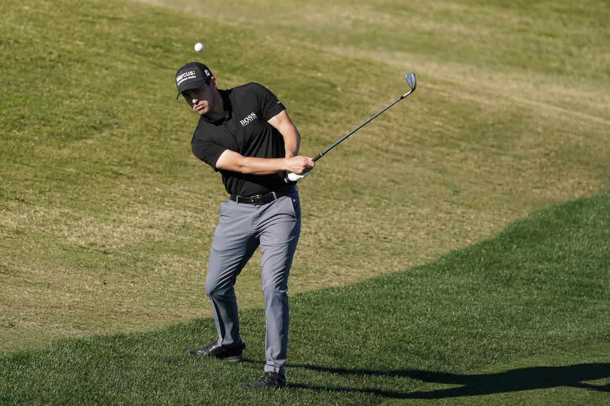 Patrick Cantlay chips to the 16th hole during the final round of The American Express golf tour ...
